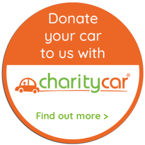 Orange circle badge with the words "Donate your car to us with" and the Charity Car logo