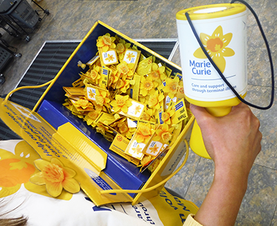 Marie Curie Collection tin held by Charity Car