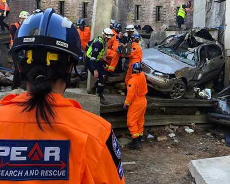 Photo of Spear Search and Rescue staff rescuing people from an incident with a car