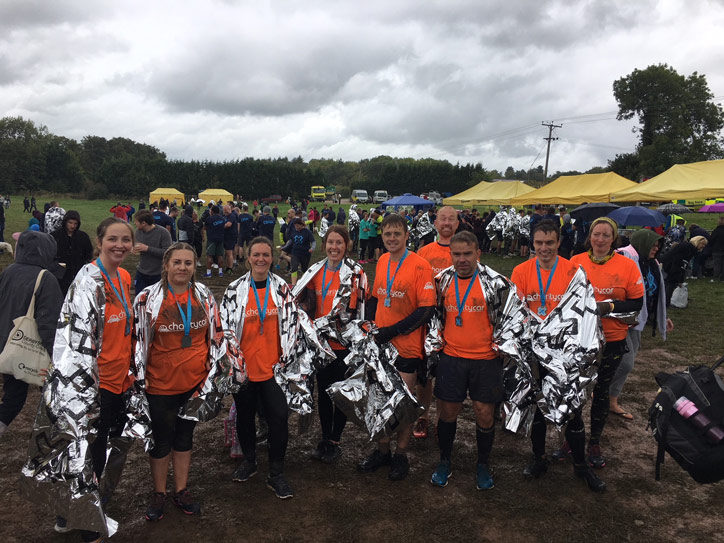 Charity Car X-Runner team at the muddy end