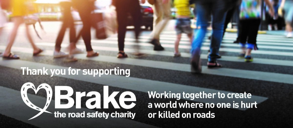 Image of people walking across a road - thank you for supporting Brake
